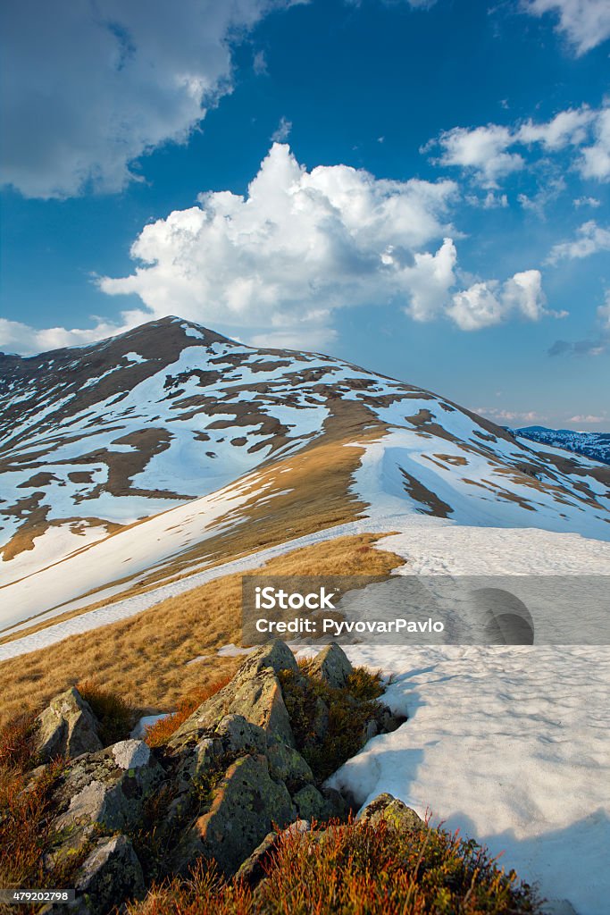 first days of spring mountain range in early spring. Spots snow beautiful clouds in the sky and a good light. 2015 Stock Photo