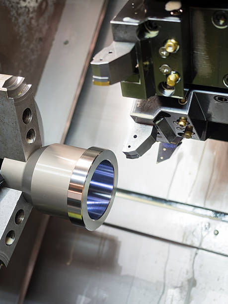 istock industrial metal work machining process on CNC lathe 479203178