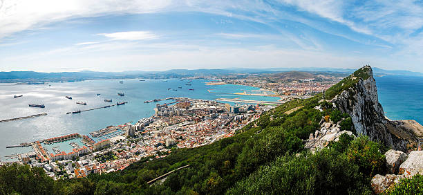 Gibraltar Rock Gibraltar Rock view from above, on the left Gibraltar town and bay, La Linea town in Spain at the far end, Mediterranean Sea on the right. gibraltar photos stock pictures, royalty-free photos & images