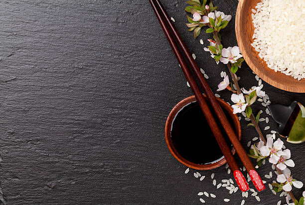 istock Japanese sushi chopsticks, soy sauce bowl, rice and sakura bloss 479206768