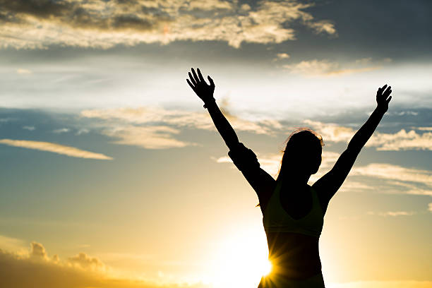 istock strong confidence woman open arms under the sunrise at seaside 479207372