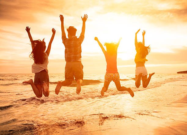 istock group of happy young people jumping on the beach 479207392