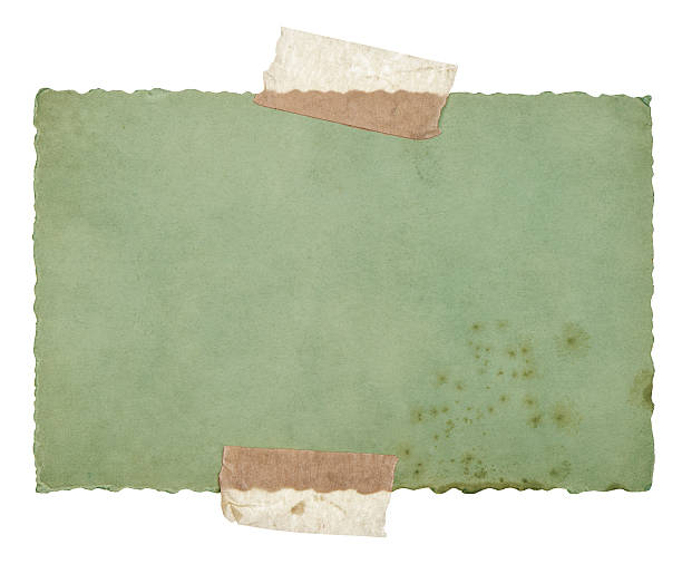 istock old green paper sheet with tape isolated on white 479208417