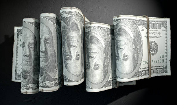 istock Wads Of Notes Pile Dark 479209248