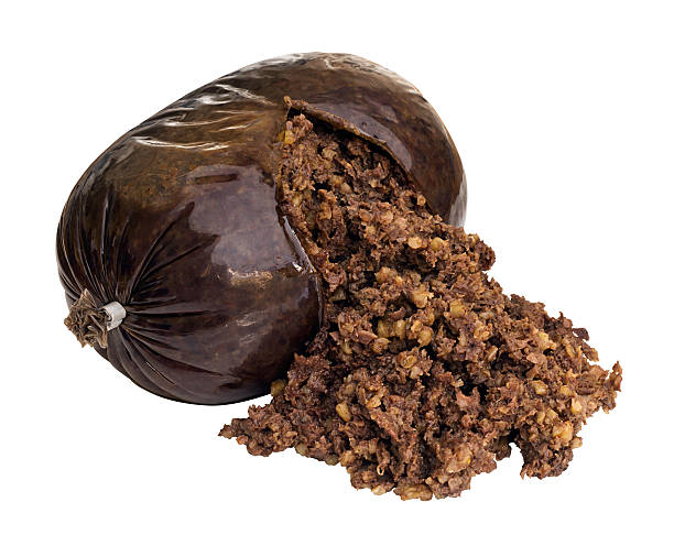 Haggis Isolated on white Haggis a traditional Scottish sausage made from sheep stomach and filled with sheeps liver, lungs and heart, oatmeal, onion, suet and seasoning. haggis stock pictures, royalty-free photos & images