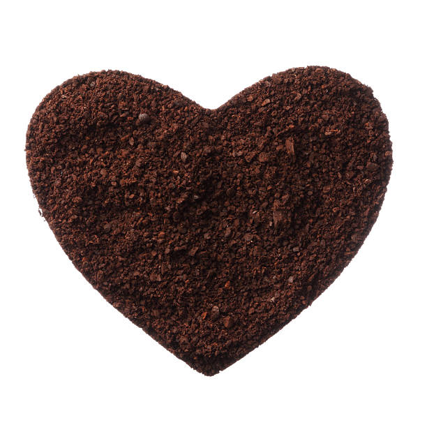 istock Ground coffee heart isolated on white background close up 479209701