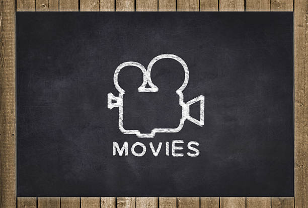 movies camera drawing  on black chalkboard