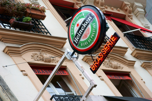 Paris, France - January 1, 2014: An advertising sign for Heineken beer on the facade of a brasserie on January 01, 2014 in Paris.