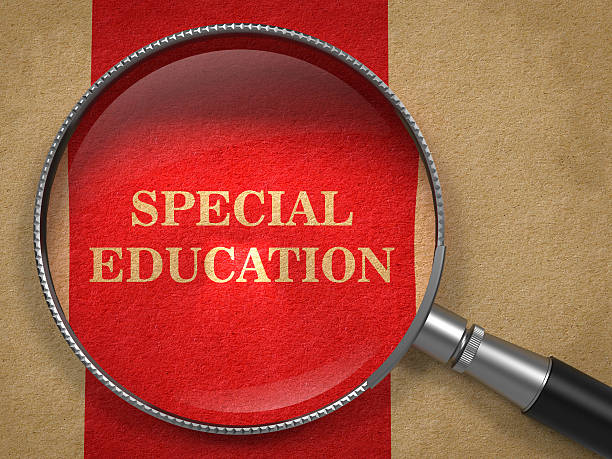 Special Education - Magnifying Glass. Special Education concept. Magnifying Glass on Old Paper with Red Vertical Line Background. special education stock pictures, royalty-free photos & images