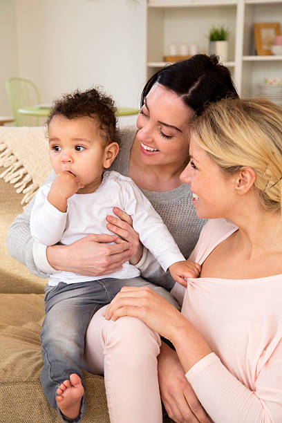 istock Female couple enjoying quality time with their son at home 479216180
