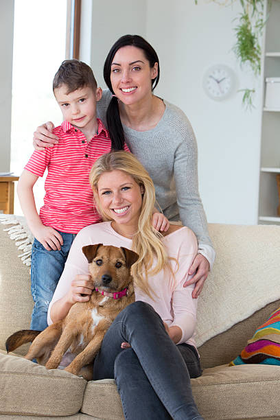 istock Female couple with son and dog at home 479216372