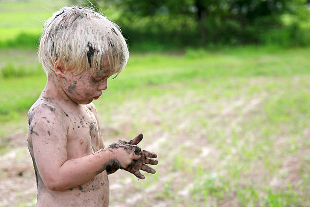 istock Cute Dirty Child Playing Outside in the Country 479216640