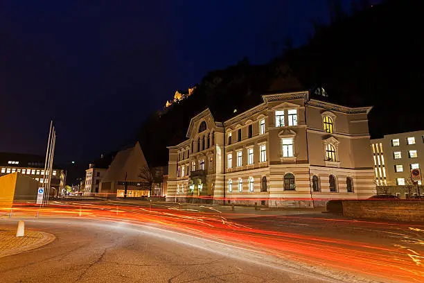 Parliament building in Vaduz during the evening traffic. Vaduz, Liechtenstein.