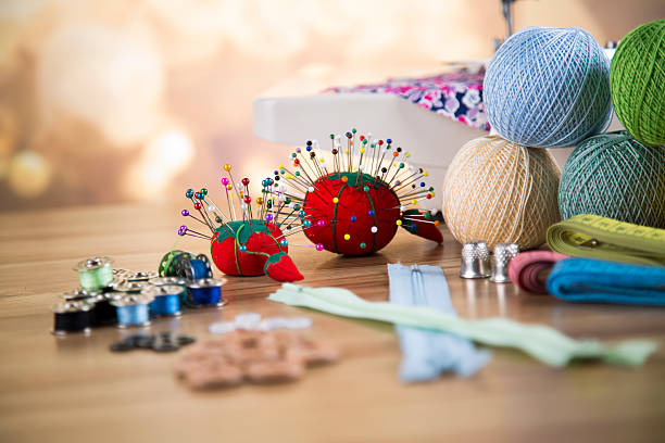 istock Sewing kit. Colored thread, pins, buttons, ribbons, safety pin. 479219470
