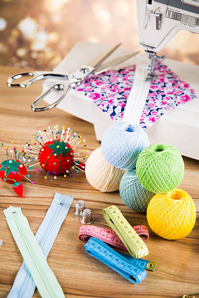 istock Sewing kit. Colored thread, pins, buttons, ribbons, safety pin. 479219848