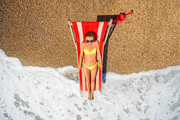istock Sunbathing on the red sunbed 479223650