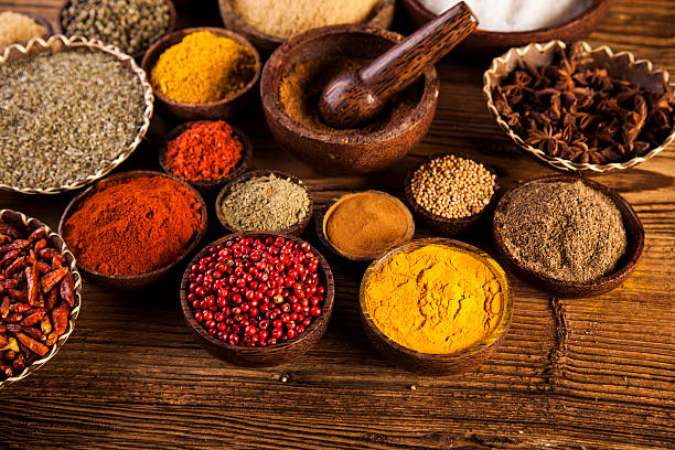 istock Spices and herbs in wooden bowls. 479224106