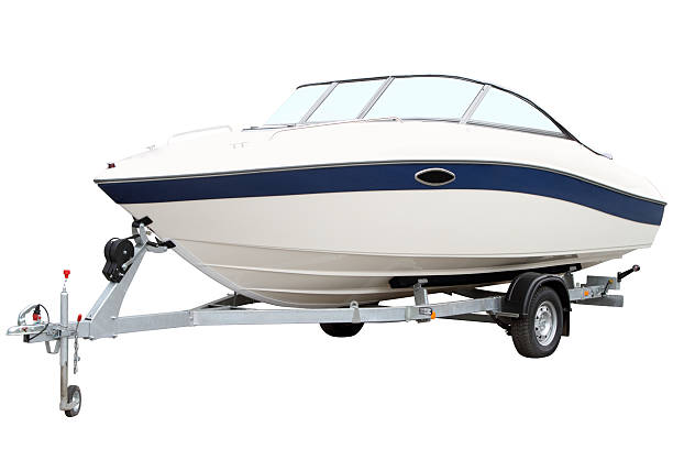 Modern motor boat Modern motor boat on the trailer for transportation small boat stock pictures, royalty-free photos & images