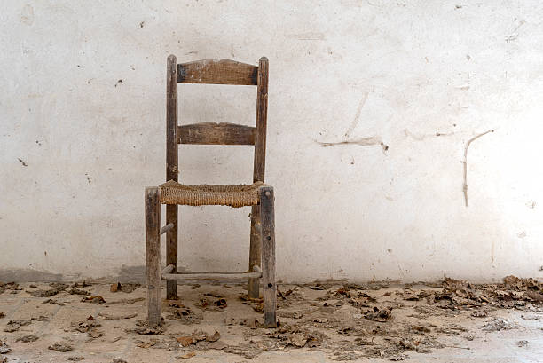 istock old chair with straw,  floor with dry leaves 479225878