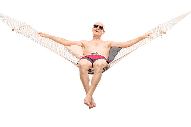 istock Relaxed senior man lying on a hammock 479226374