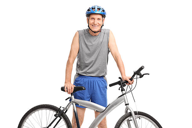 istock Active senior in sportswear posing behind a bicycle 479226564