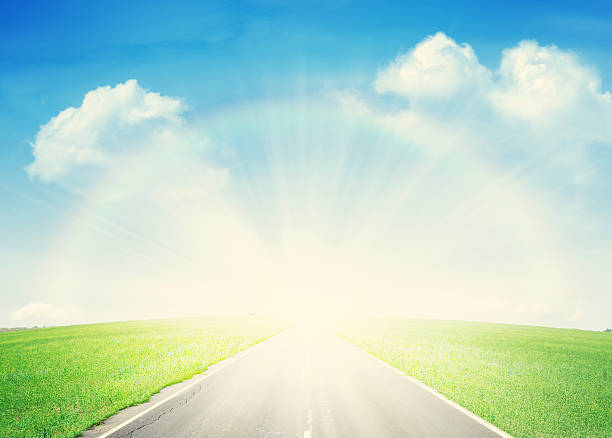 istock Asphalt road through the green field and rainbow 479226844