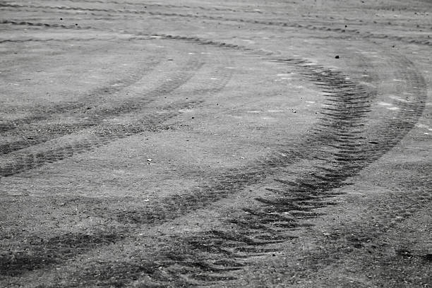 istock Turning black tire tracks over dark asphalt road 479226958