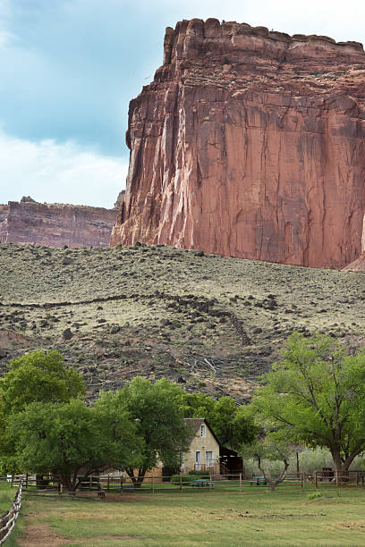 istock House beneath a large red rock formation 479227674
