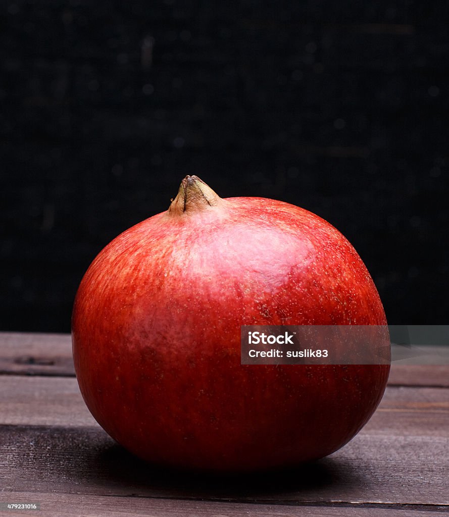 pomegranate ripe pomegranate on a wooden table 2015 Stock Photo