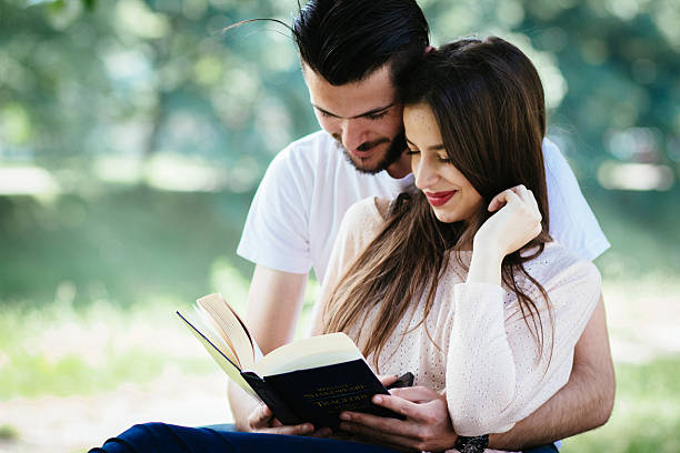 istock Couple reading a book together 479232458