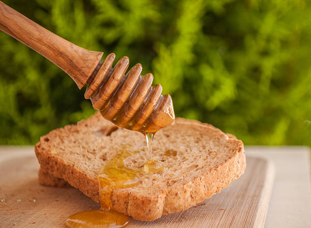 istock toasted bread with honey and honey dipper 479234194