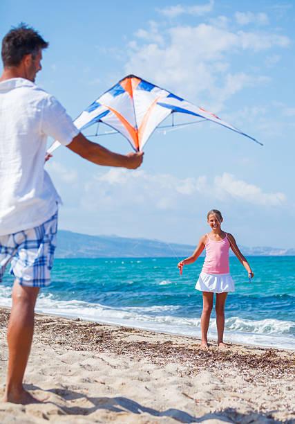 istock Girl and father with kite 479234202