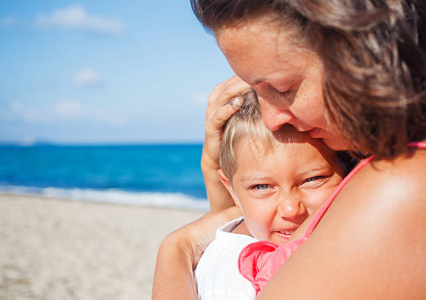 istock Mother and her son at beach 479235448