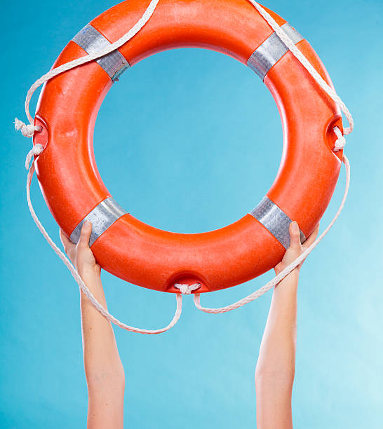 istock Life buoy ring in female hands 479235698