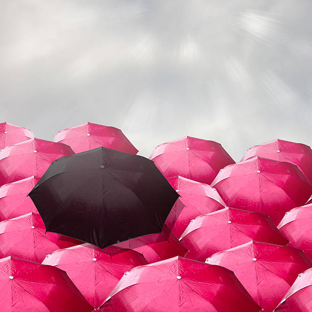 istock Black umbrella in a red umbrella gorup. Concepcion regarded the 479236478