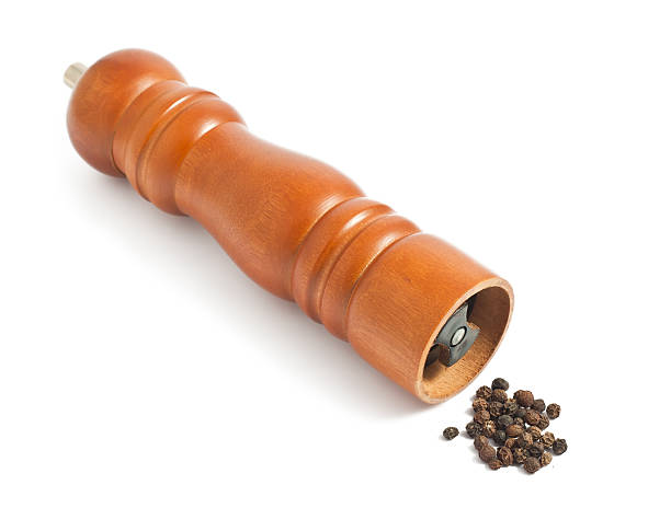 istock Wooden pepper grinder on white background 479237280