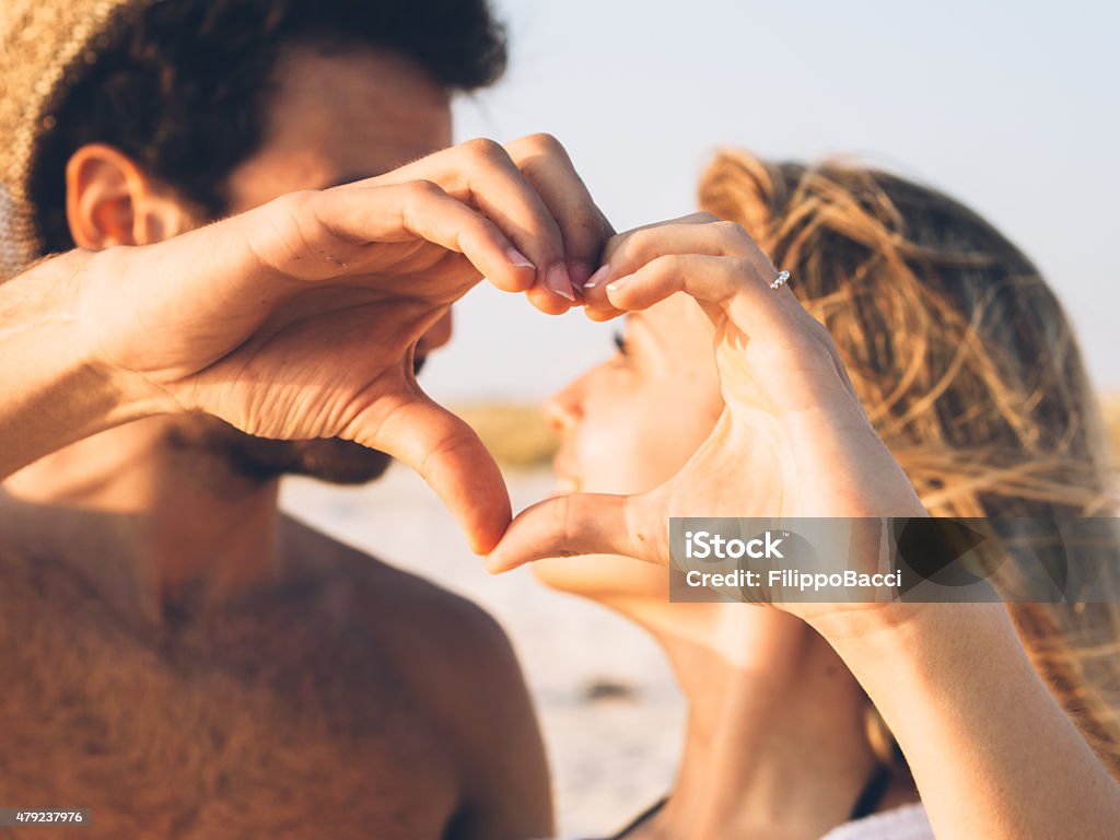 Young Couple In Love On The Beach Couple - Relationship Stock Photo