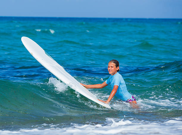 istock Girl with surf 479238388