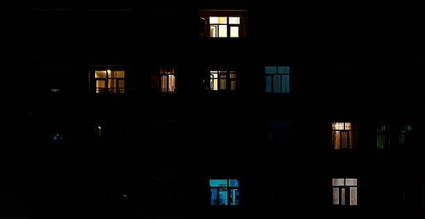 istock Turned on light in the windows in the building 479242854
