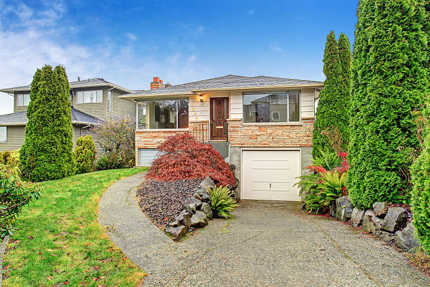 istock Traditional house with small garage and walkway. 479244720