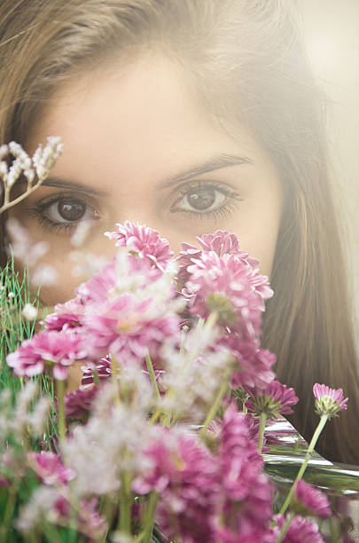 istock Young Woman with flowers 479248306