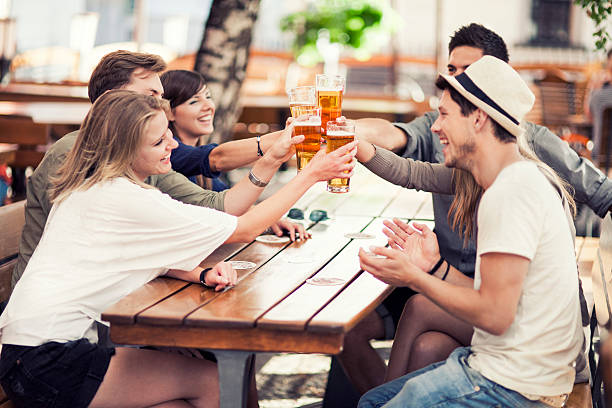 istock Young people drinking beer outdoors 479252774