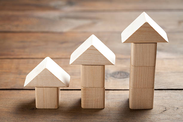 istock Wooden toy houses on old table 479255314