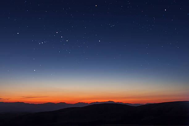 stars and sunset - orion bulutsusu stok fotoğraflar ve resimler