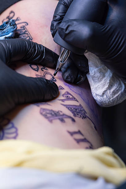 istock Girl Getting Tattoo 479267480