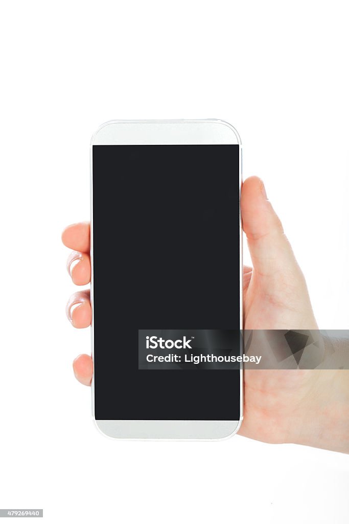 Human hand holding large modern smart phone on white background Human hand holding large modern smart phone on white background. Vertical orientation. Blank screen ready for your message 2015 Stock Photo