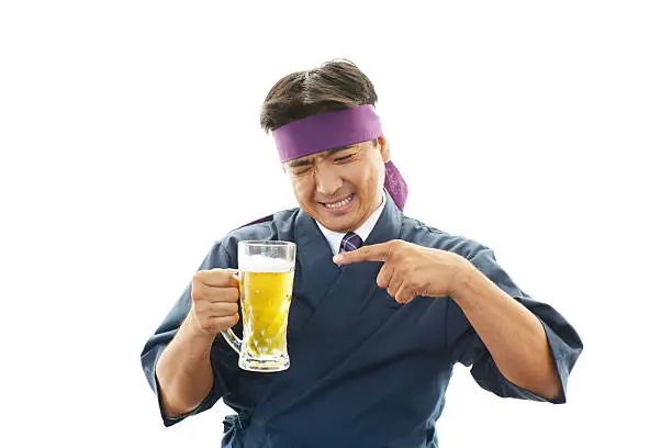 Smiling Asian waiter with beer