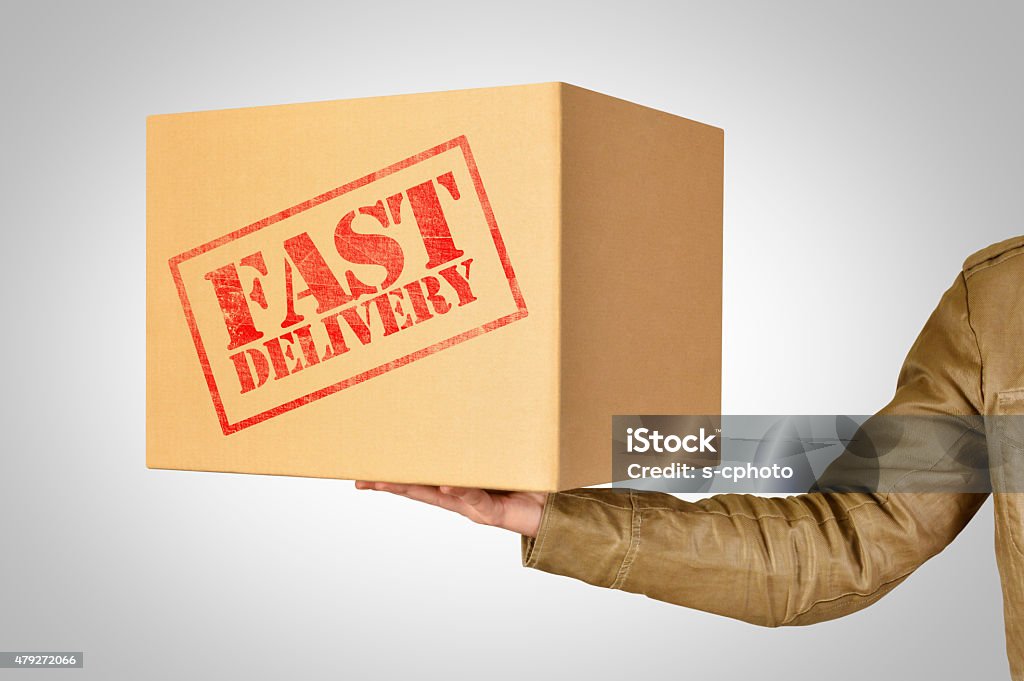 Fast delivery, A delivery man holding cardboard box Box - Container Stock Photo