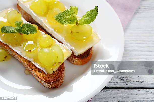 Crostini With Cheese And Grapes Stock Photo - Download Image Now - 2015, Appetizer, Baguette