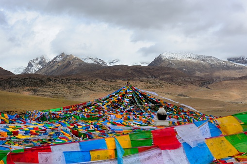 Prayer flags in the snowy mountain.